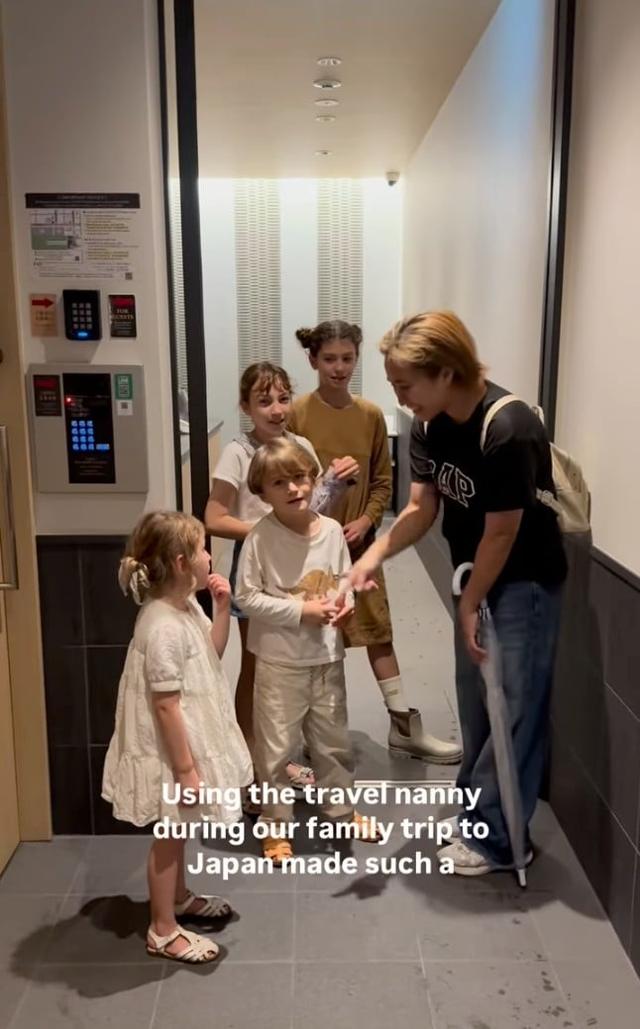 Nanny greeting the children at the hotel room door